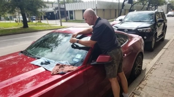 Mobile Rock Chip Repair On Red Sports Car
